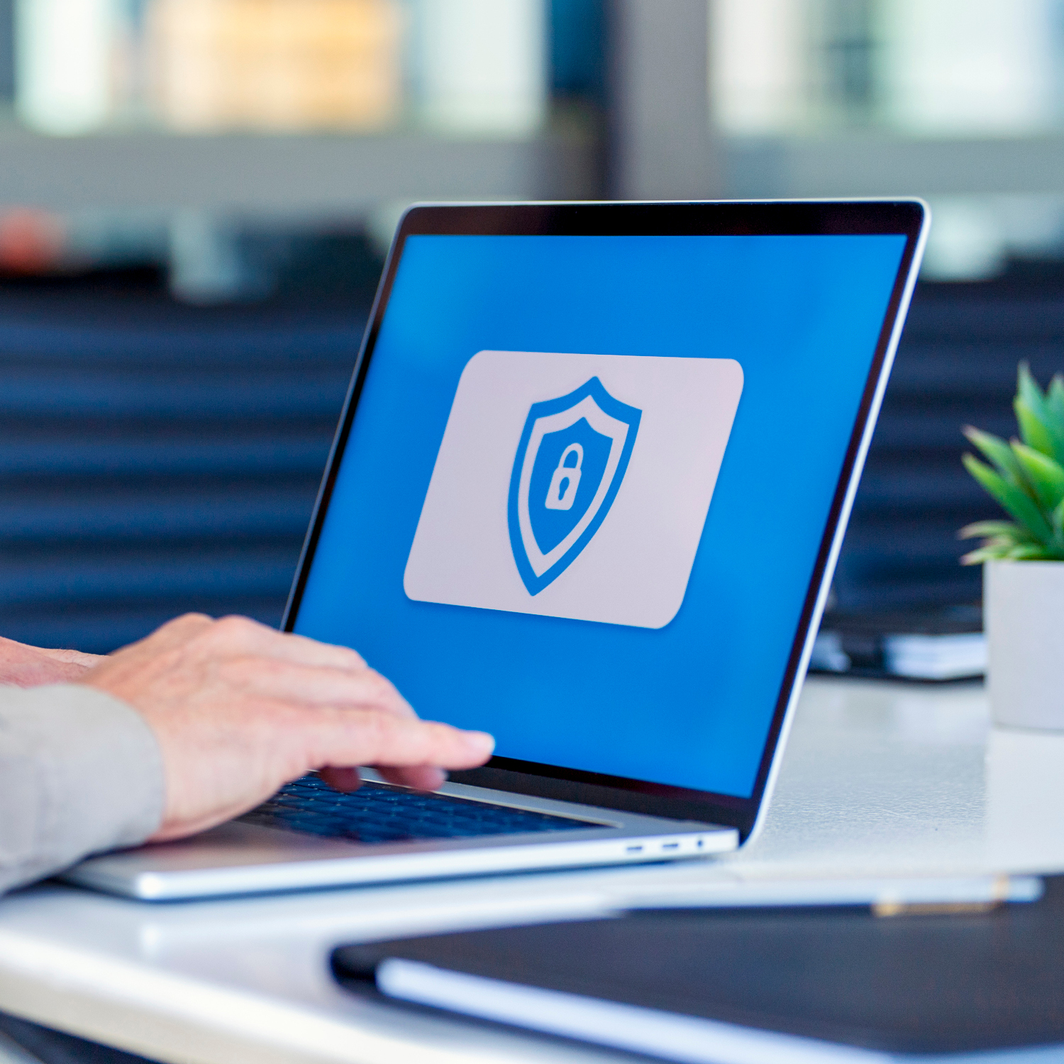 Closeup photo of a laptop showing a security icon