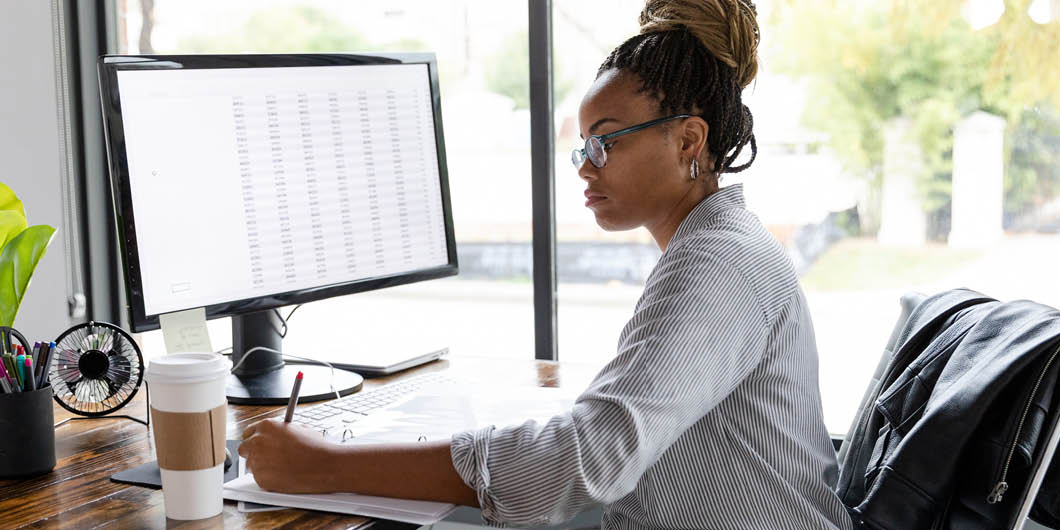 Woman working at a computer